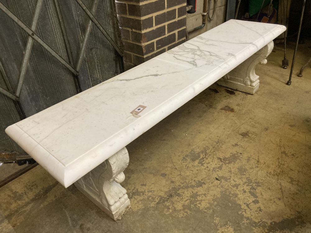 An early 20th century Italian carved white marble bench, with later marble top, width 182cm depth 45cm height 48cm
